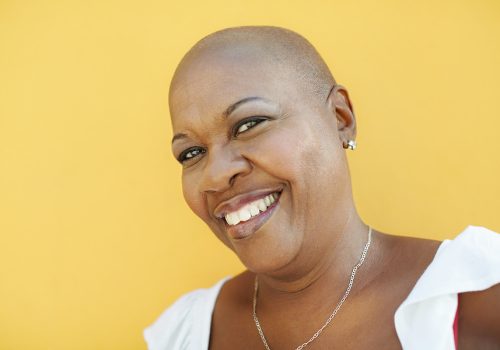 Bald woman smiling