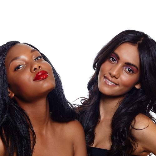 Black woman with long extensions with Indian woman with long wavy hair