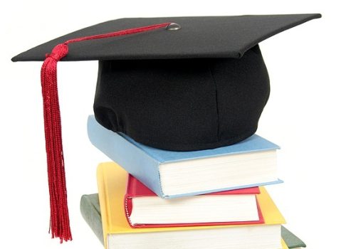 Graduation Cap On Top Of Stack Of Books