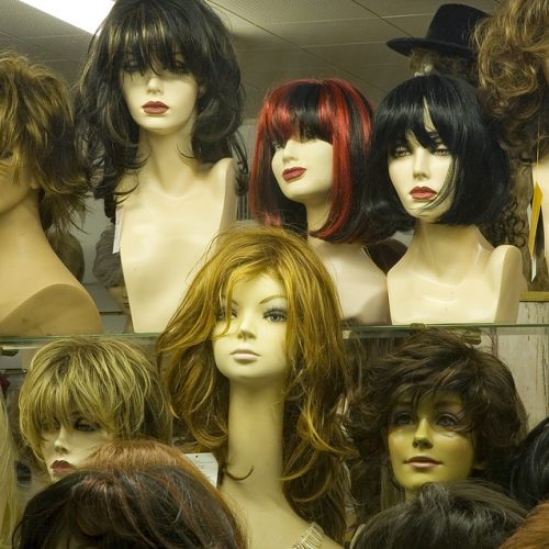 Mannequin heads with wigs in shop window