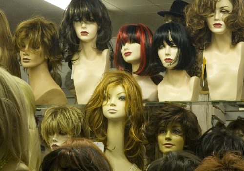 Mannequin heads with wigs in shop window