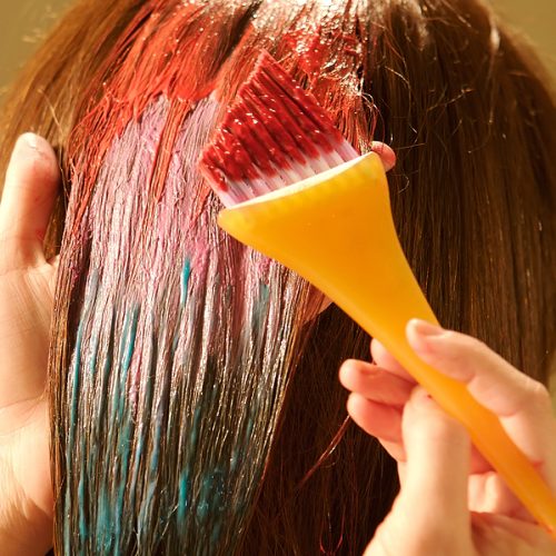 Woman having her hair colored at the hair salon