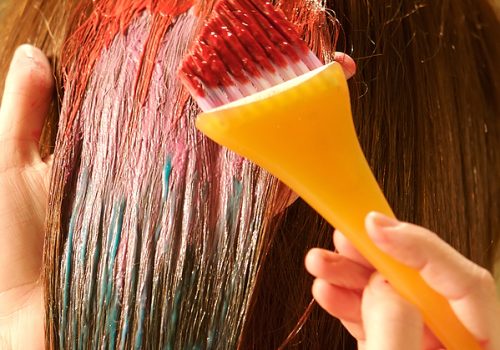 Woman having her hair colored at the hair salon