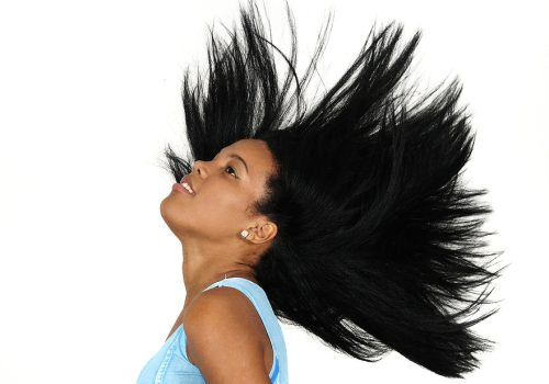 Woman swinging her long dark hair 2